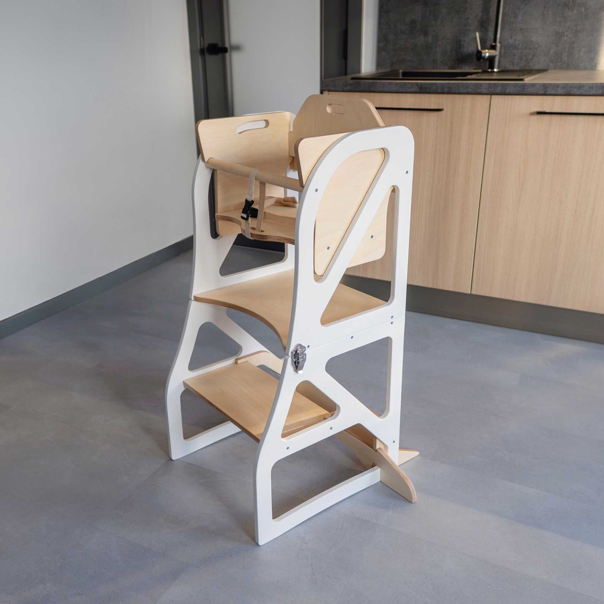 Wooden transformable kitchen tower converted into a high chair for everyday use.