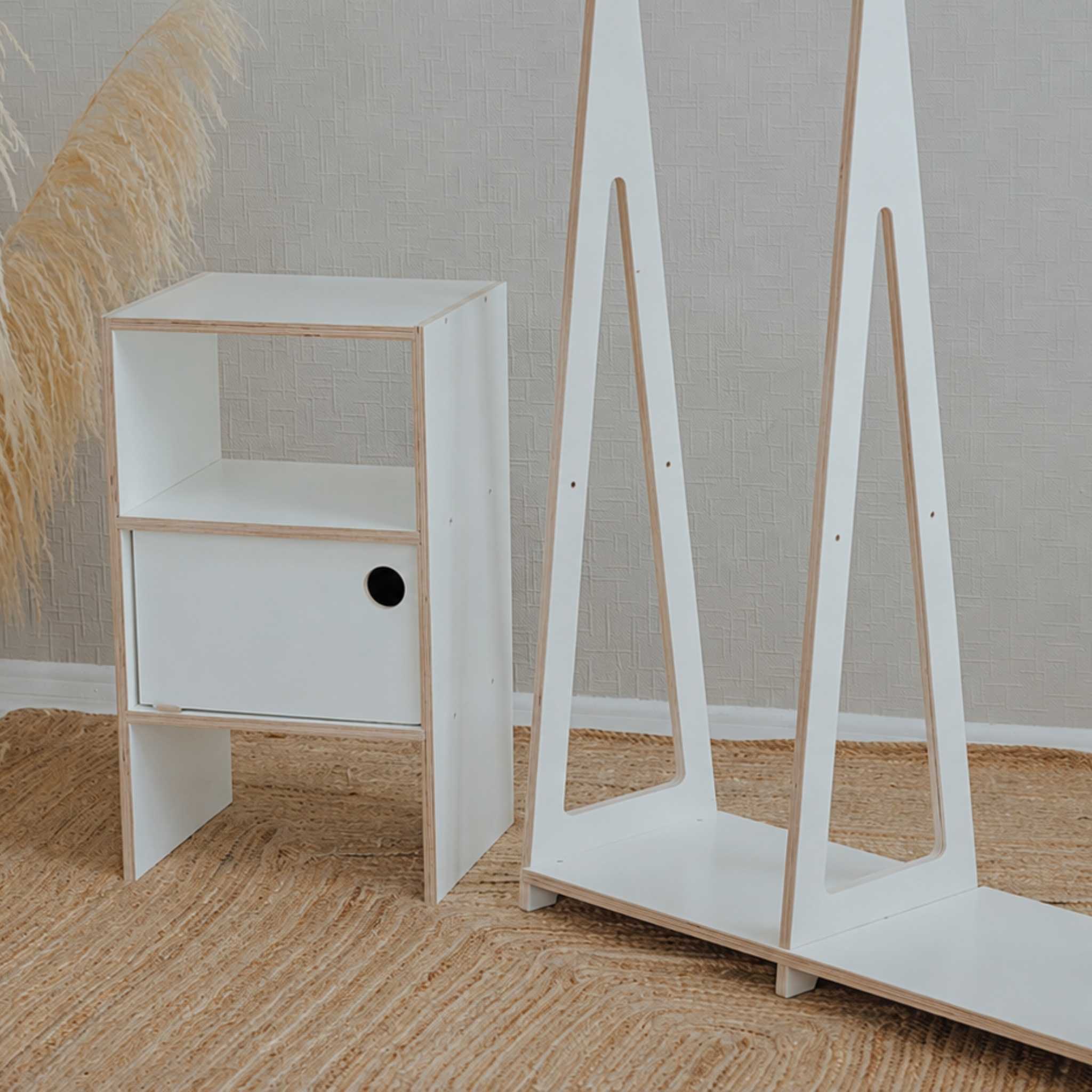 Modern white Montessori wardrobe with open clothing rack and storage cabinet